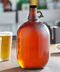Glass jug with black cap, part of 12 Pack 38mm Growler Caps With Durable Poly Seal Lids For Half Gallon And One Gallon Glass Jugs Replacement Tops