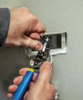 Person using wire stripper from Outlet Repair Tool Kit With GFCI Receptacle Tester, Non Contact Voltage Tester, And Wire Stripper.