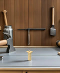Adjustable Aluminum Alloy Furniture Legs Round Golden Cabinet Feet With Rubber Base Set Of Four displayed on workbench