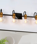 4 Light Modern Farmhouse Vanity Light Fixture In Black With Oil Rubbed Bronze Finish And Clear Globe Glass Shades 29.5 Inch Bar Design For Bright Welcoming Bathroom Lighting mounted above a mirror
