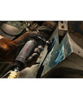 Worker using One Quarter Inch Right Angle Die Grinder With Composite Housing Twenty Thousand RPM One Third HP on metal corner