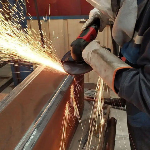 Top Shelf Heavy Duty 7 Inch Air Angle Grinder With Two Point Two Horsepower Motor And 8500 Rpm grinding metal with sparks flying.