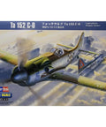 Box art of Ta 152C-0 Fighter Aircraft 1/48 Scale Kit With Dope Photo-Etch Details flying over clouds.
