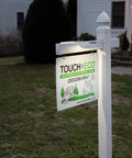 Solar Dual Sided LED Post Light For Real Estate Signs And Business Yards illuminating a yard sign at dusk.