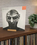 Legit Solid Hardwood Turntable Stand For LP Records And Album Jackets To Show Off Your Fresh Vinyl Collection While Spinning Tracks Without Messing Up Your Smooth Lounge Or Desk Area Setup with a vinyl record on display.
