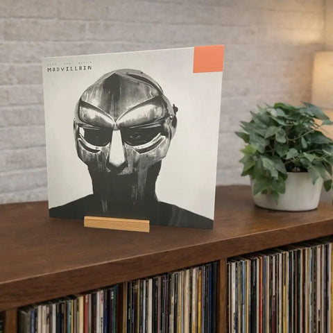 Legit Solid Hardwood Turntable Stand For LP Records And Album Jackets To Show Off Your Fresh Vinyl Collection While Spinning Tracks Without Messing Up Your Smooth Lounge Or Desk Area Setup with a vinyl record on display.