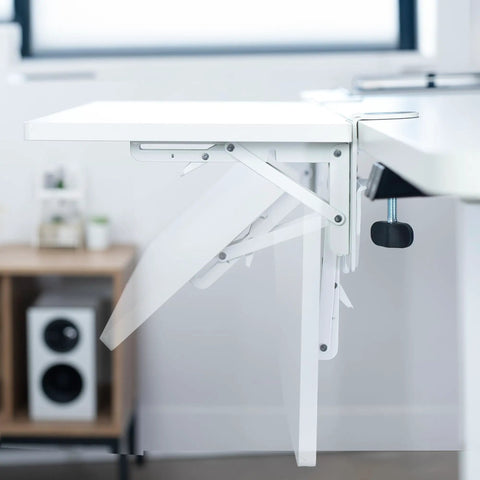Close-up of a White Clamp On Desk Extender For A Sweet Home Office Upgrade Foldable Desktop Shelf with metal hinge.