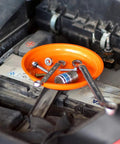 Magnetic Parts Tray Set With Two Magnetic Bowls And Telescopic Magnetic Pick Up Tool For Easy Garage Organization Holds Nuts And Bolts And Small Parts Reaches Up To 25.3 Inches Keeps Your Tools Neat And Ready; orange magnetic bowl on engine holding screws and nuts.