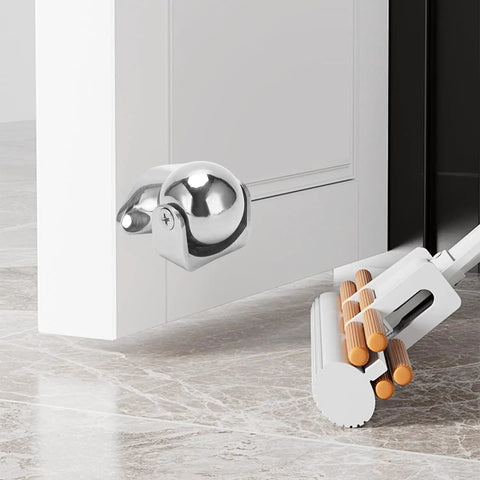 Beefy Marine Grade 316 Stainless Steel Door Stopper With Magnetic Hold installed on white door, polished hardware visible