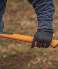 Person holding the IsoCore Shock Reducing 8 Pound Double Flat Face Sledge Hammer 36 Inch Beast Demolition Tool handle in gloved hand.