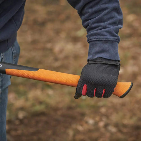 Person holding the IsoCore Shock Reducing 8 Pound Double Flat Face Sledge Hammer 36 Inch Beast Demolition Tool handle in gloved hand.
