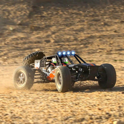 1-12 Scale All Terrain RC Truck With 4x4 Drive High Speed 38 Km/h Remote Control Car racing off-road in a dusty terrain