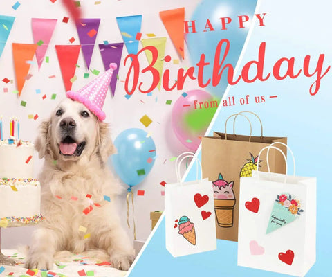 Eco Friendly Kraft Paper Gift Bags 100 Pack with birthday theme, dog and decorations, handles showing, 5.25x3x8 inches.