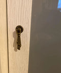 Antique Bronze Metal Drawer Cabinet Pulls 2 Pack With Screws, Single Hole Drop Handles 0.75 X 2.36 Inches, installed on cabinet