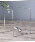 Newton Pendulum Ball Desk Decor Stainless Steel Kinetic Art For Home Office Learning Balance And Momentum Stress Relief Desktop Toy Science Experiment Tool For Kids And Adults displayed on wooden surface with plant in background.