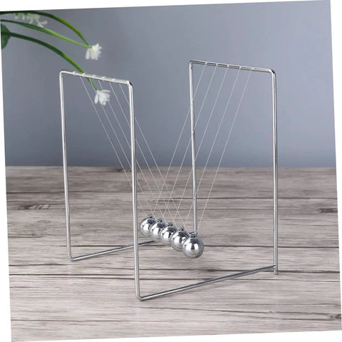 Newton Pendulum Ball Desk Decor Stainless Steel Kinetic Art For Home Office Learning Balance And Momentum Stress Relief Desktop Toy Science Experiment Tool For Kids And Adults displayed on wooden surface with plant in background.