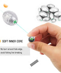 Hand holding removable egg lead fishing sinker, set of 20 for saltwater drop shot fishing, 1/10 oz, lightweight and streamlined oval weights.