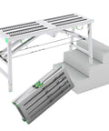 Heavy Duty Folding Scaffold Tower With Adjustable Height Work Platform shown as a folded step ladder on stairs.