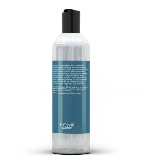 Front view of a bottle labeled Pure Mineral Oil For Wood Care 8 Fl Oz No Additives Colorless Odorless Tasteless Safe For Cutting Boards Butcher Blocks And Wooden Utensils Undiluted Packaged In The USA.