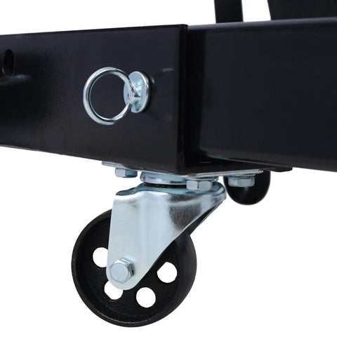 Close-up of castor wheel and mounting of Heavy Duty 2 Ton Folding Engine Hoist With Hydraulic Lift Cylinder And 6 Smooth Rolling Iron Caster Wheels For Shop Ready Projects And Backyard Gearhead Builds.
