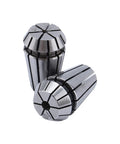 Close-up of two CNC spring collets for precision milling lathe tasks. Made of hardened spring steel, high clamping force.