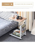 Grab And Go Rolling Laptop Desk Stand With Locking Wheels Adjustable Mobile Workstation Table For Bed Couch Gaming Or Living Room Smooth Ride Chill Spot Flat Surface with oak top and white metal legs.