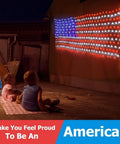 Children watch Patriotic Flag String Lights With Solar Or USB Power, 420 LED Net Light illuminating a wall outdoors at night.
