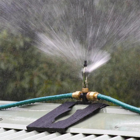 Heavy Duty 360 Degree Rotating Rooftop Sprinkler For Backyard Boss Lawn Cooling And Garden Watering With Smooth Sweep Adjustment And Built Different Zinc Frame spraying water outdoors.