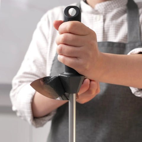 Person using Diamond Sharpener Rod For Knives With Built-In Angle Guides, 12-Inch, Extra Fine 1200 Grit, in kitchen setting.