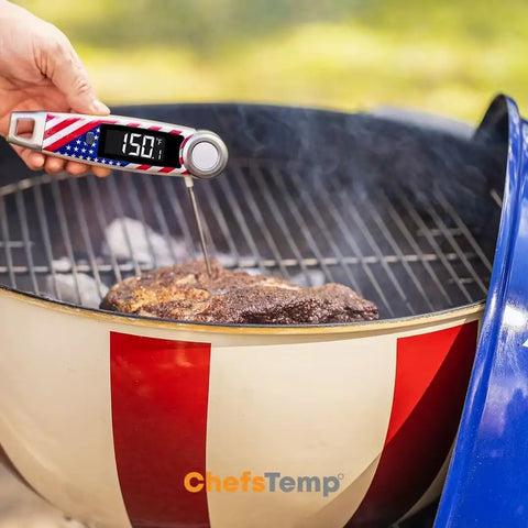 Hand using X10 Instant Read Digital Meat Thermometer With Rotating Probe Backlit Display And Waterproof Pro Kitchen Tool for BBQ.