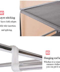 Heavy Duty Freestanding Wardrobe Closet With Steel Hanging Rod And Open Shelves For Bedroom Storage Game Changer Cream detailed view of layer stitching and hanging rod hook