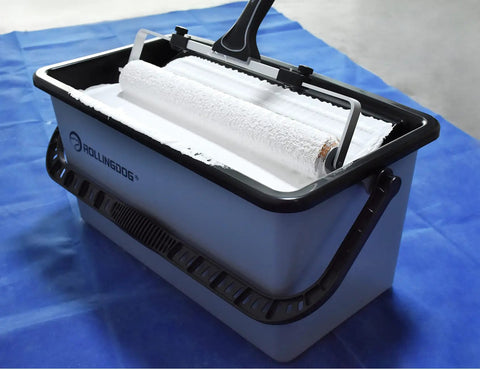 Pro Grade 20 Piece Paint Roller Set With Adjustable Frame And Extension Pole Jumbo Mini Roller Includes 18 Inch Bucket With Tray and roller in paint.