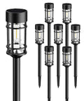 Eight Pack Solar Pathway Lights Outdoor Waterproof 21 Inch Metal And Glass Landscape Driveway Garden Path Lights shown with black metal stakes.