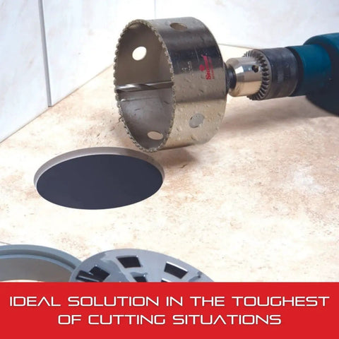 Diamond Grit Hole Saw For Small Diameter Holes 2-1/2 In Diameter 1-5/8 In Cutting Depth 5/8-18 Thread XA2/XA10 Arbor Silver Finish Pro Grade Tool For Quick Clean Drilling In Non Metallic Materials shown on tile surface with drill attachment, illustrating its application.