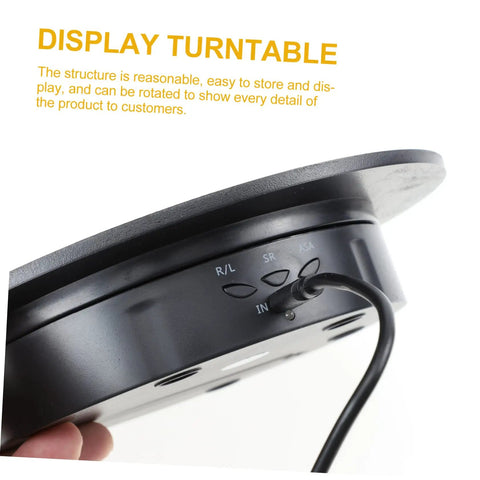 Smooth Rotating Jewelry Display Stand With Adjustable Speed Motorized Turntable For Retail Store Showcase And Product Photography Features black base and control buttons.