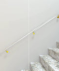 Hella Tough Clear Acrylic Railing One Point Six To Nineteen Point Seven Feet No Sweat Wall Mounted Non Slip Guard For Indoor And Outdoor Decks installed on stairs with gold brackets.