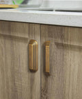 Six Pack 5 Inch Antique Brass Cup Pulls With Distinctive Layered Ribbed Multi Sectioned Design For Classic Cabinets And Drawers installed