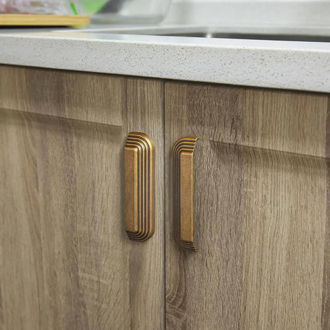 Six Pack 5 Inch Antique Brass Cup Pulls With Distinctive Layered Ribbed Multi Sectioned Design For Classic Cabinets And Drawers installed