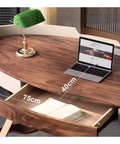 Top Shelf Ergonomic Standing Desk With Integrated Monitor Riser, Versatile Ash Wood Computer Table featuring a laptop and drawer.