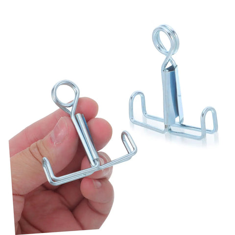 Hand holding a clamp from the 25 Piece Laboratory Rubber Tube Clamps For Flow Control With Spring Loaded Latex Hose Water Stop Clips And Flat Jaw Sealing Clamps