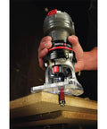 Person using Beast 5.6 Amp Laminate Router With Variable Speed From 16,000 To 35,000 RPM One Quarter Inch Collet Cast Aluminum Fixed Base