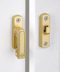 Adjustable Flip Gate Latch Lock For Sliding Barn Doors Heavy Duty Zinc Alloy Build Smooth 90 To 180 Degree Swing Easy Top Bottom Left Right Mounting No Sweat Install Glossy Gold Finish Closet Hardware installed on white doors.
