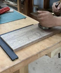 Person using DT04 Woodworking Planing Stop No Fuss For 20mm Dog Holes, Heavy Duty Bench Dog Clamp on workbench with thin board