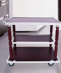 Heavy Duty Industrial Kitchen Bar Cart With Built In Wine Rack And Three Tier Storage Shelves On Smooth Rolling Casters Vintage Wood Steel Serving Trolley Game Day Ready Patio Go To in a kitchen with dark cabinets.