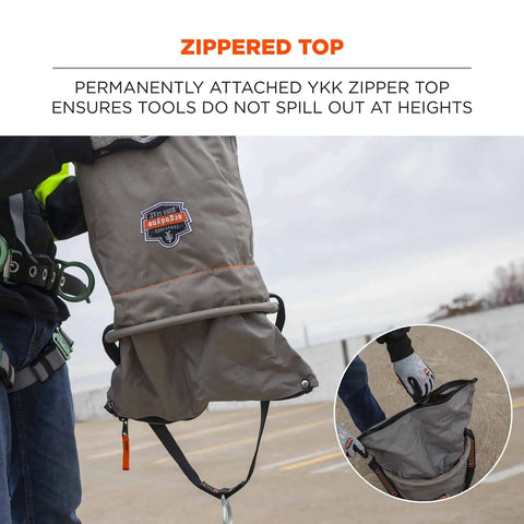Worker holding 5973 Large Nylon Hoist Bucket Tool Bag With D-Rings and Zipper Top Gray, showing YKK zipper top.