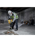 High Power 60V Brushless Cordless Chipping Hammer With SDS Max Chuck And Rear Handle Setup For Rapid Concrete Tear Out in use on concrete.