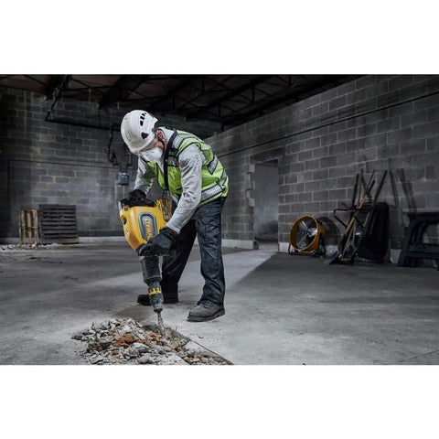 High Power 60V Brushless Cordless Chipping Hammer With SDS Max Chuck And Rear Handle Setup For Rapid Concrete Tear Out in use on concrete.