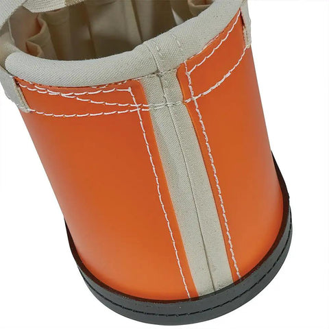 Close-up of an orange non-conductive exterior of a Hard Body Tool Bucket With 15 Interior Pockets Aerial Oval Design Non Conductive Plastic Exterior And Durable Polypropylene Bottom Drain Holes For Quick Dry Keeps Your Tools Organized Safe And Ready Between Jobsites.