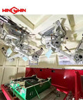 Waterjet intensifier pump assembly with green base and silver overhead frames; two units shown