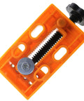 Legit Tight Grip Mini Table Vise With Quick Release ABS Plastic Jaws in orange, showing clamping mechanism for tiny parts.